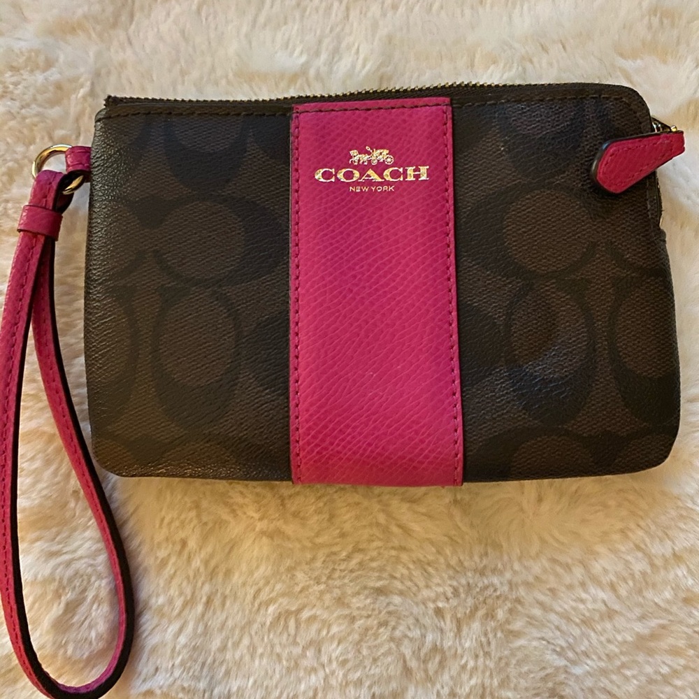 Coach Leather wristlet with hot pink accents. NEVER USED